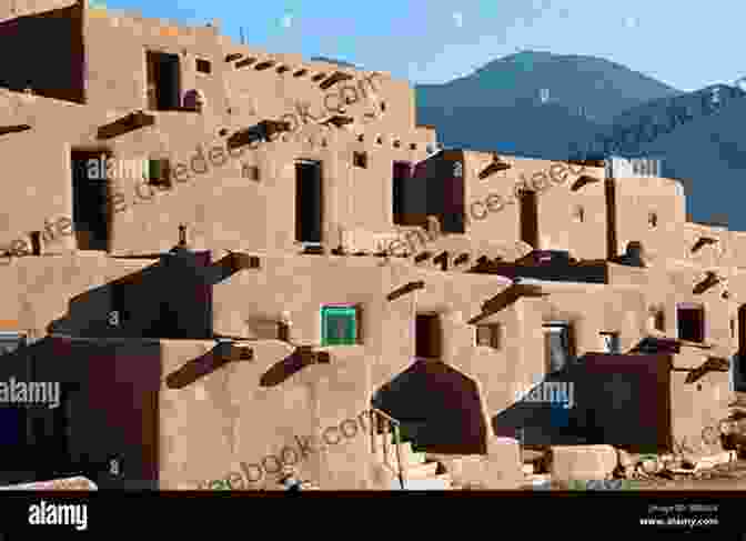 Adobe Buildings And Mountains In Taos, New Mexico. Romantic Escapes In America S Southwest